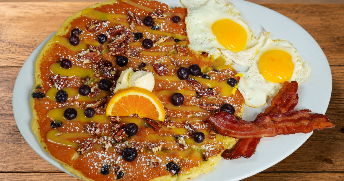 Blueberry Pecan & Lemon Glaze Flapjack with blueberries, candied pecans, eggs and bacon at Hash House A Go Go Mohegan Sun